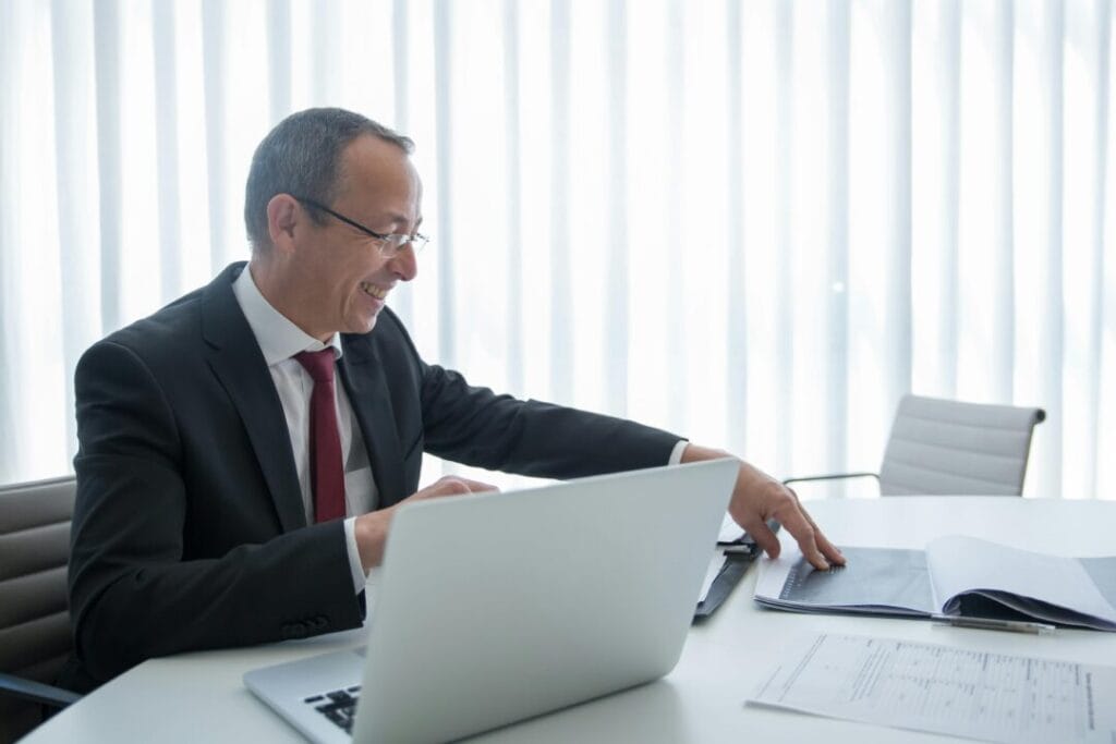 Professional using SpineLegal Software for efficient legal case management in a modern office setting.