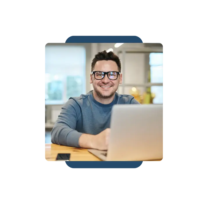 Smiling professional using SpineLegal Software for efficient legal management on a laptop.