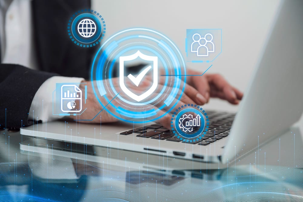 Person using SpineLegal software on laptop with security and data icons on screen.