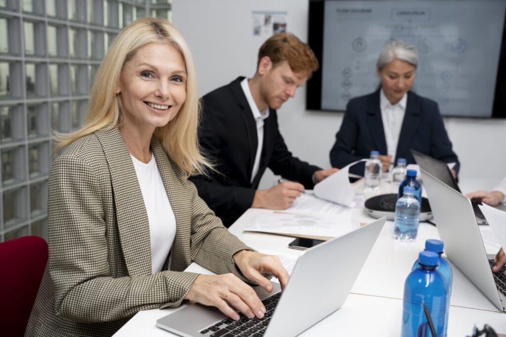 Professionals using SpineLegal Software in a collaborative office meeting.